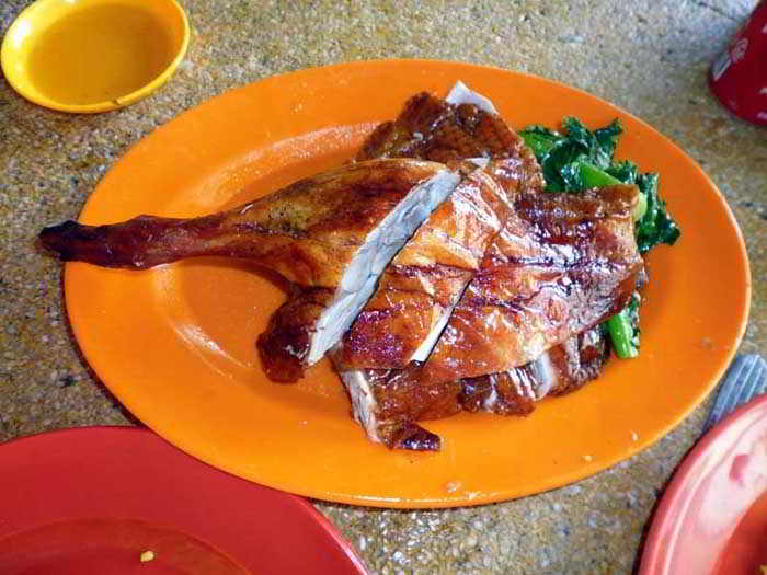Roast goose leg and sauce at Chen Chen Goose restaurant Kuala Lumpur